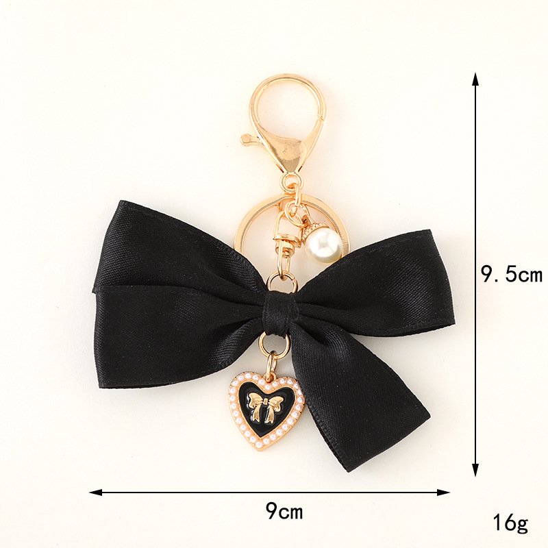 قلادة على شكل فيونكة من القماش - مراجعة Women Bags Ysl وسعره